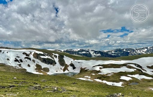 a snow covered mountains and a lake