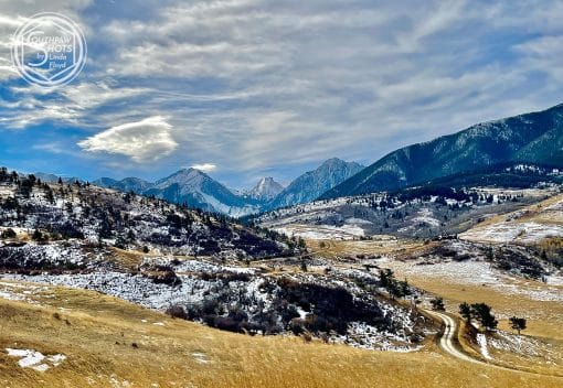 a snowy mountains and a road