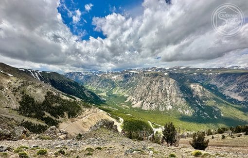 a mountain landscape with clouds and blue sky
