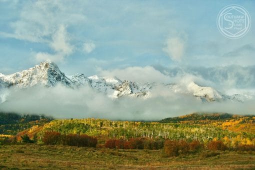 a mountain range with clouds