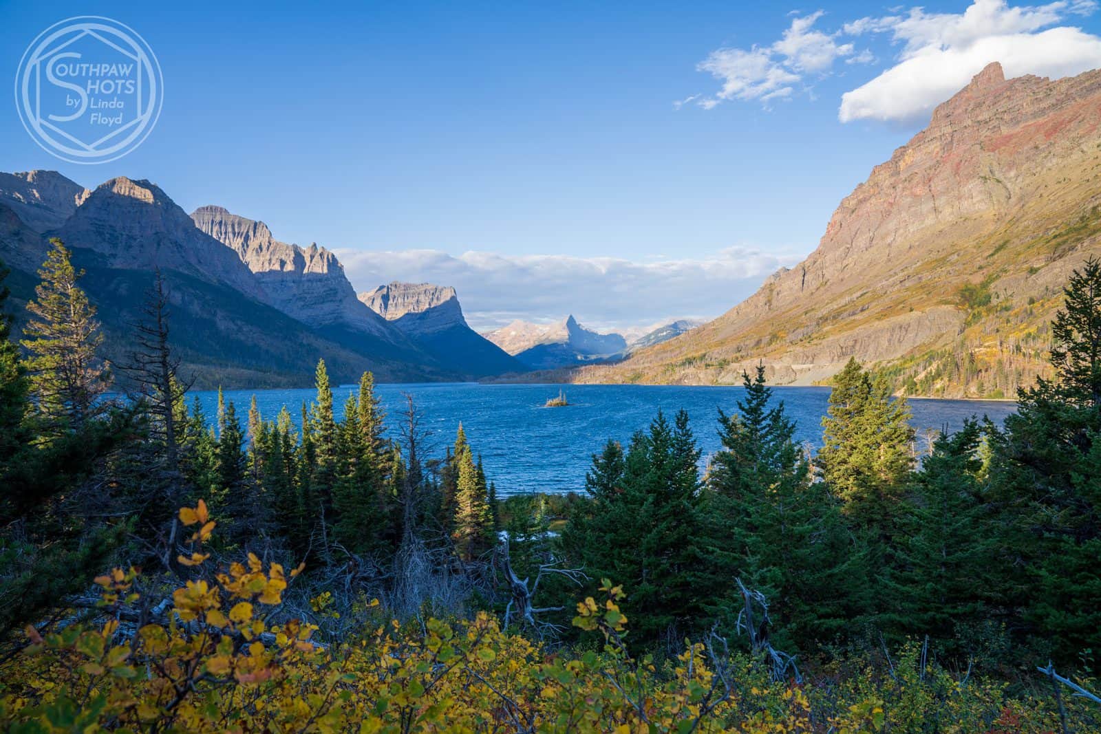 a lake surrounded by mountains, serene vistas, natures beauty